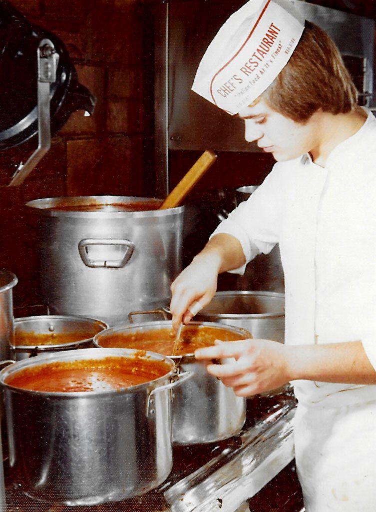young Lou Jr checking on sauce